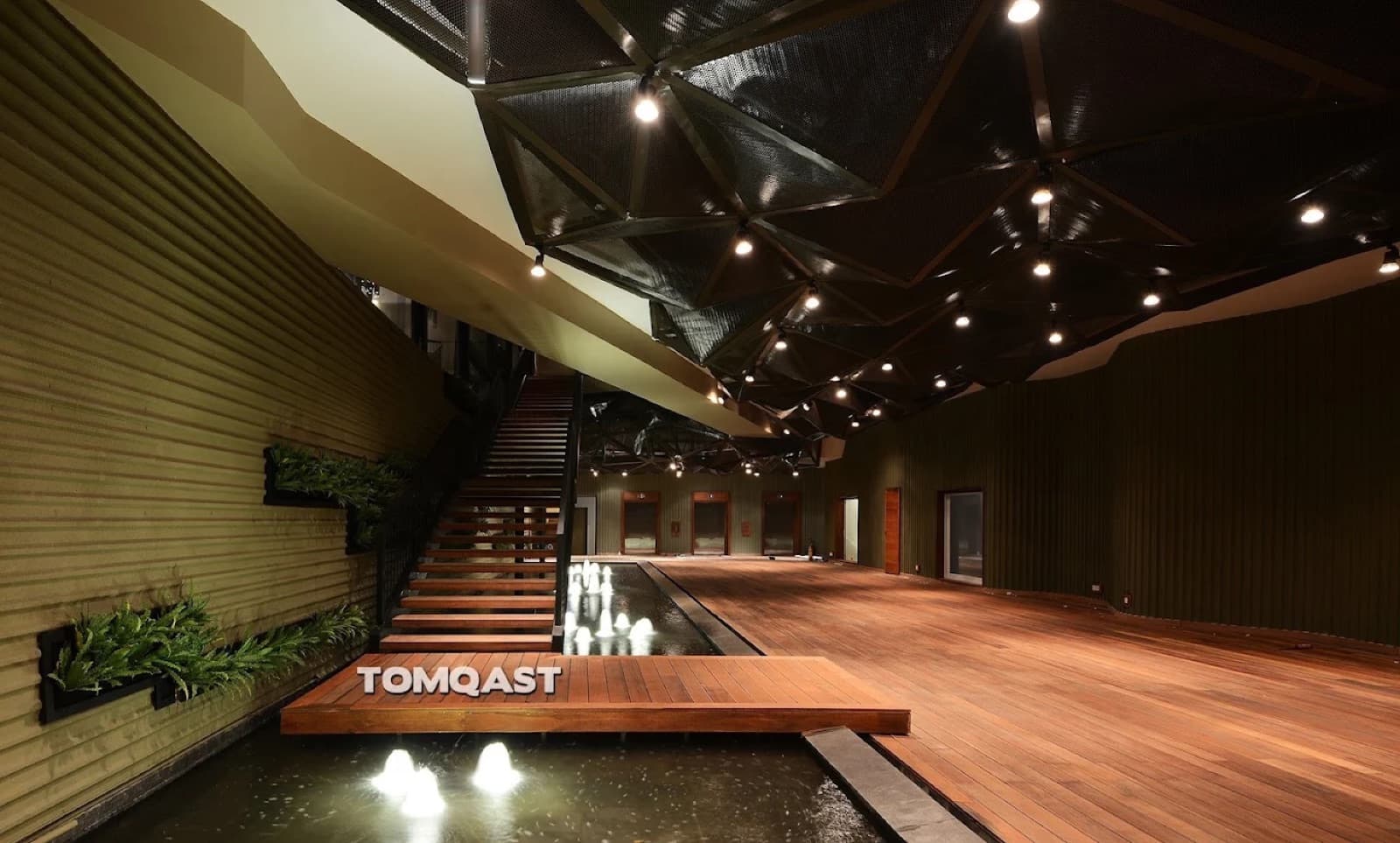Era at GEM Center, the covered function space with reflecting pool and angular mesh ceiling