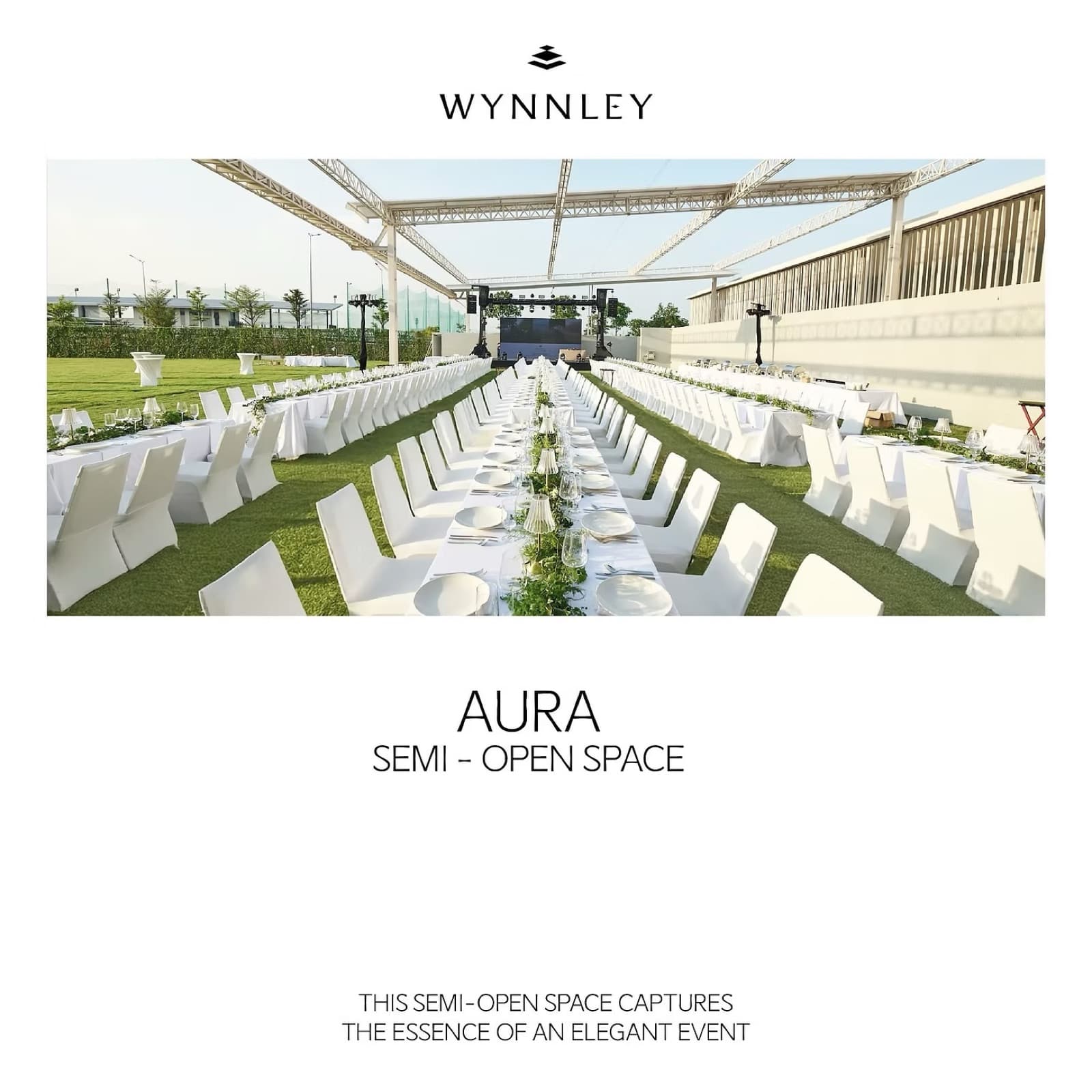 Long banquet table set on the lawn at Wynnley's AURA semi-open zone, under a steel canopy structure