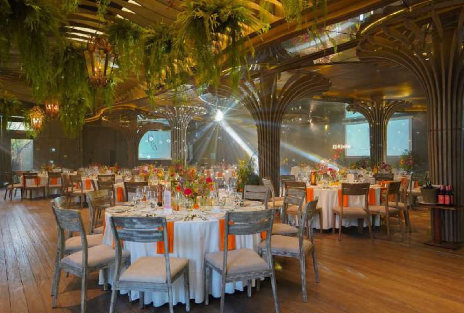 Sông Garden Ballroom set with round banquet tables and stage lighting