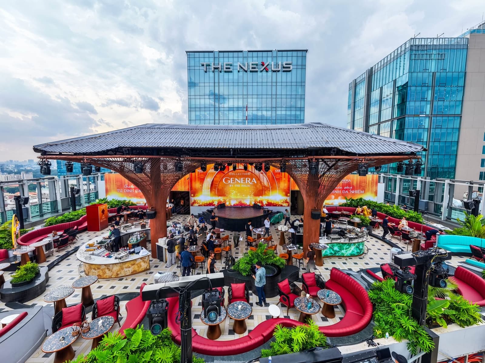 Daylight view of KÉN SKYBAR's rooftop stage, LED screens and seating
