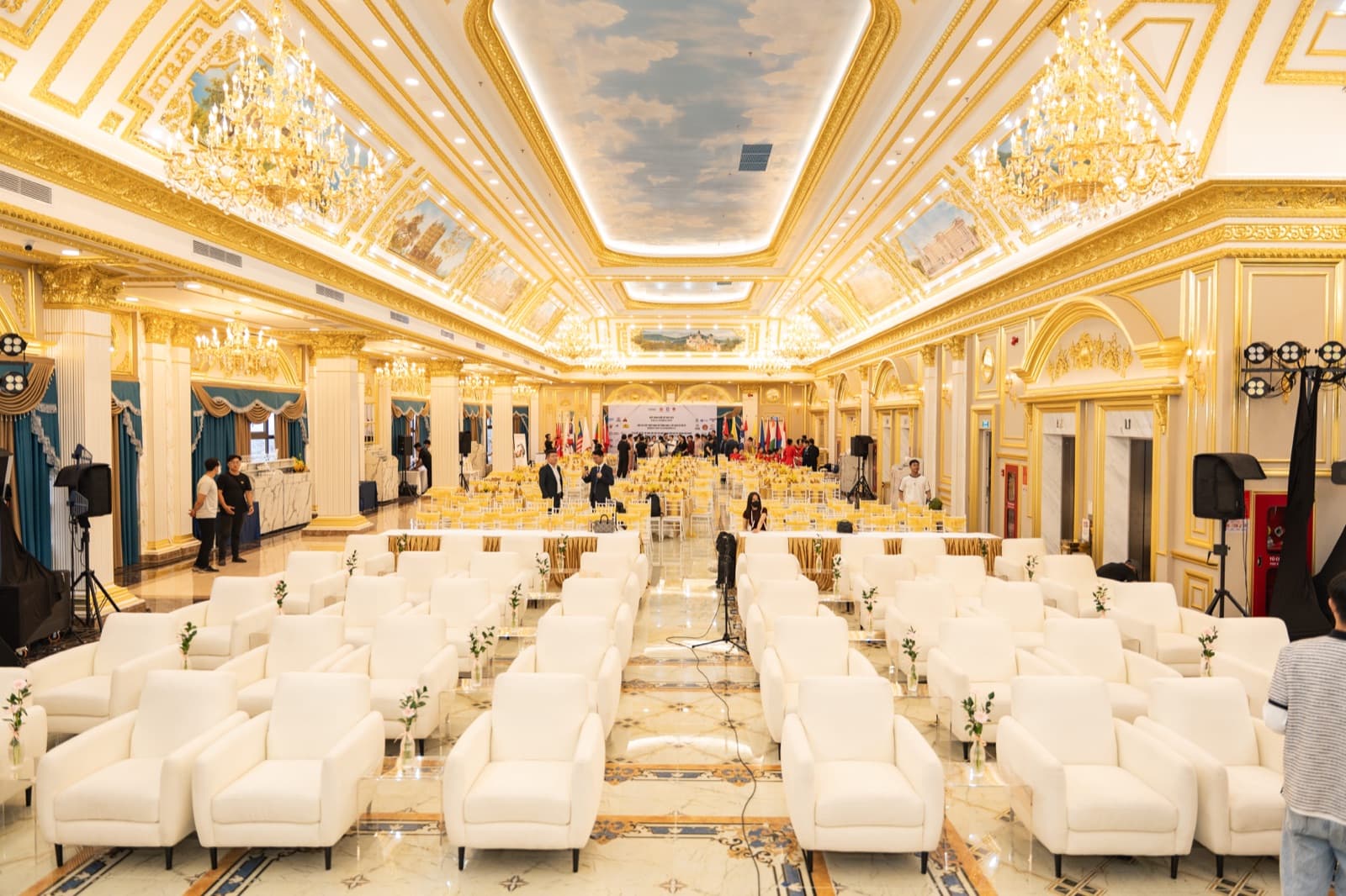 La Crown Ballroom laid out for a banquet with round tables, unoccupied.