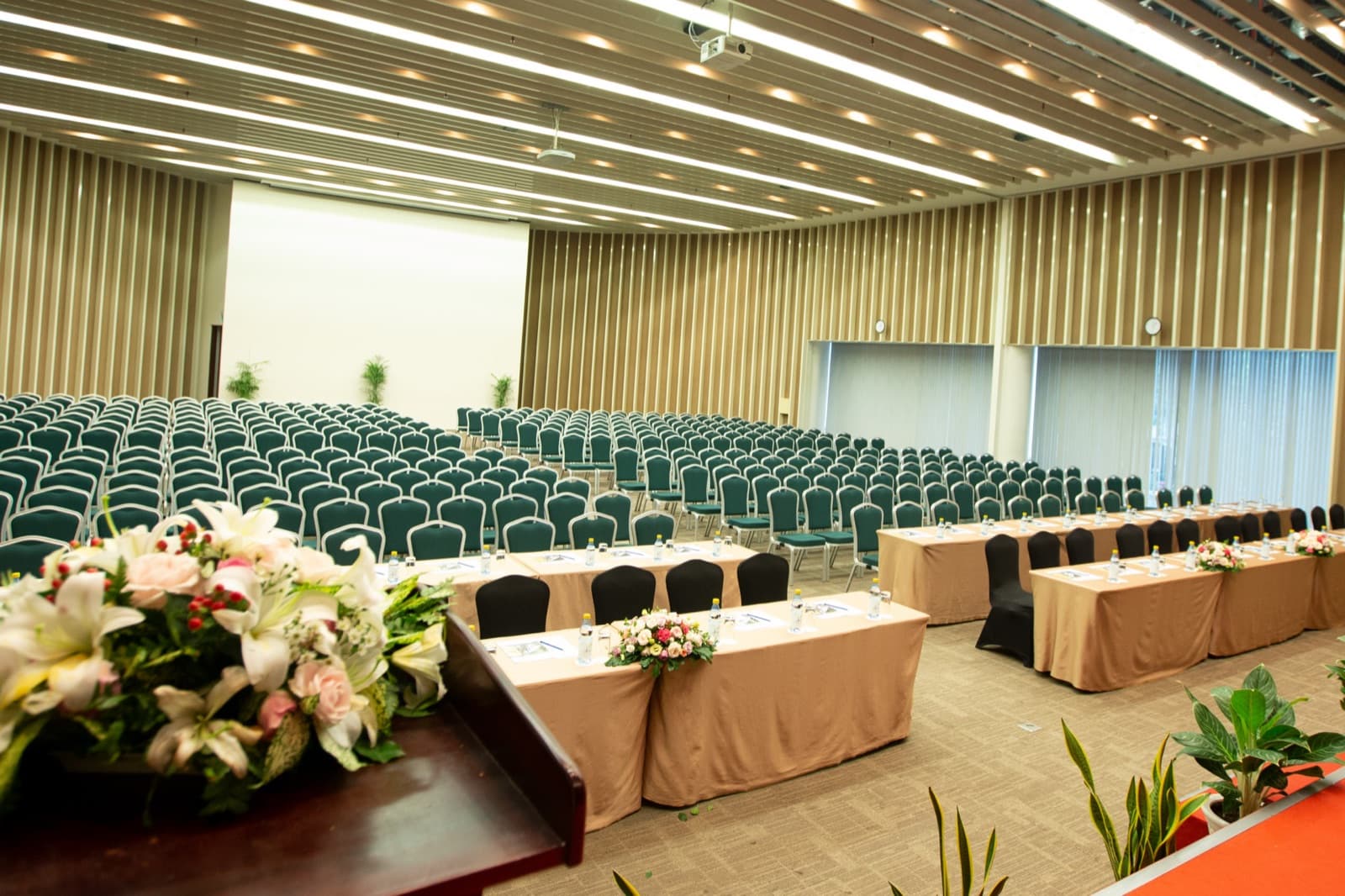 Conference Hall arranged in theatre rows with a front panel table