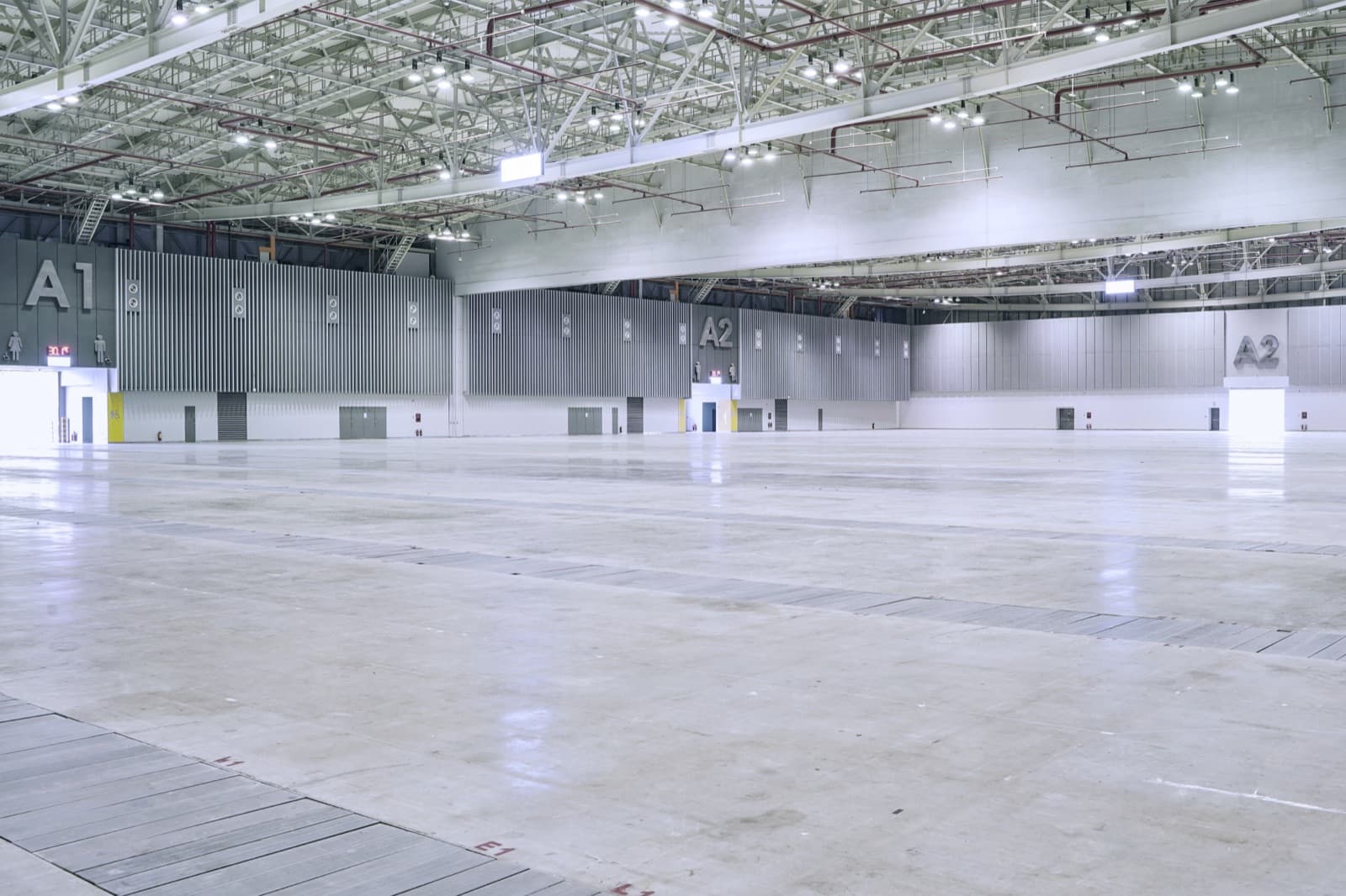 Empty SECC Exhibition Hall A with marked loading doors