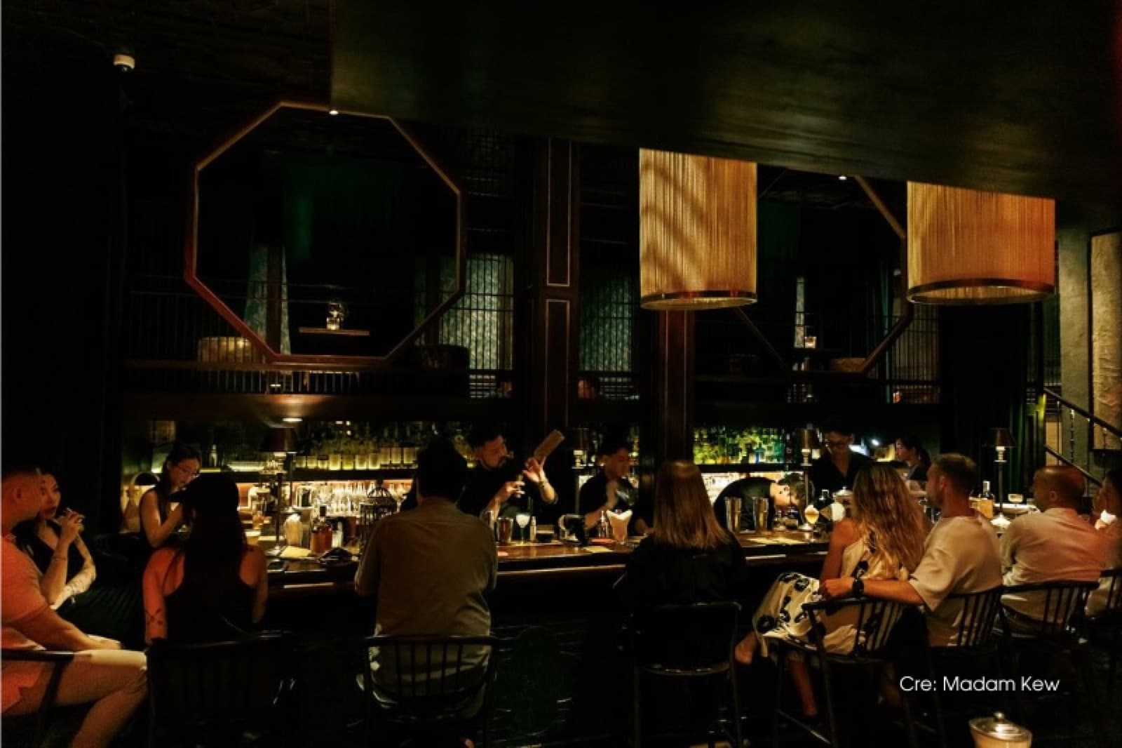 The Madam Kew bar room at The Myst Đồng Khởi, showing its East Asian and European interior detailing.